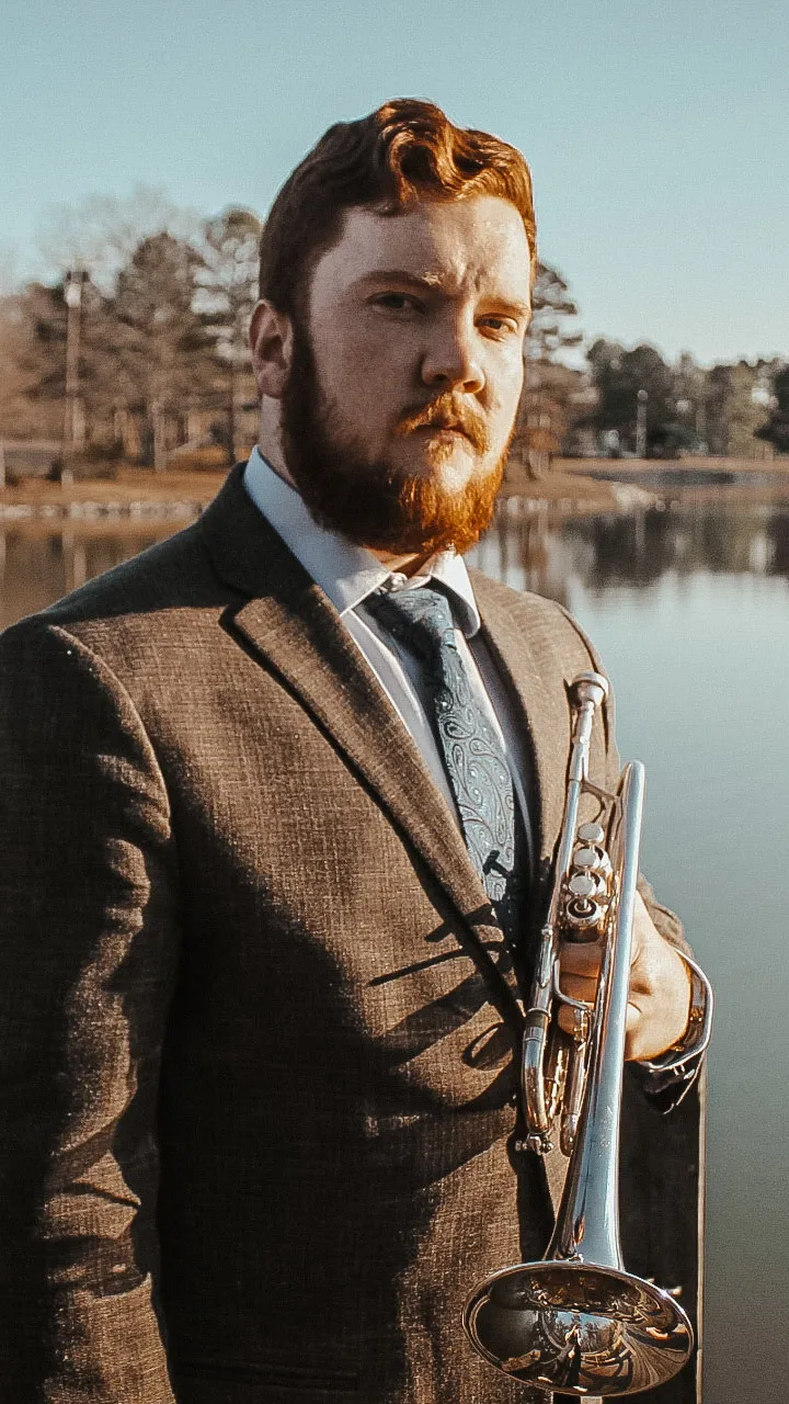 Tyler in front of a lake